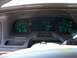 1995 Mercury Grand Marquis - The digital dashboard displays speed, odometer, and fuel level, with the gear selector in Park.