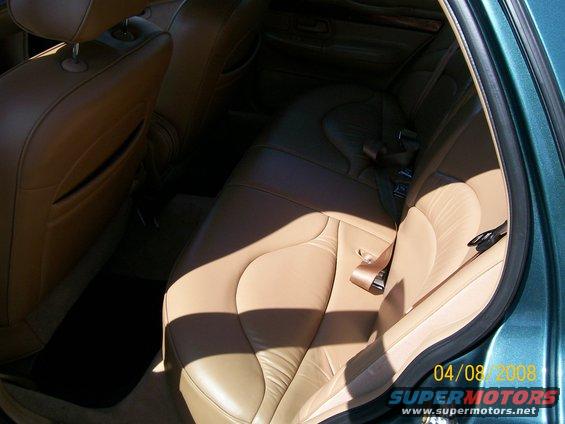 Tan leather seats and interior trim of a car, with a date stamp of 04/08/2008