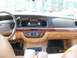 1995 Mercury Grand Marquis - The interior of a car shows the dashboard, steering wheel, and center console with a radio and climate controls.