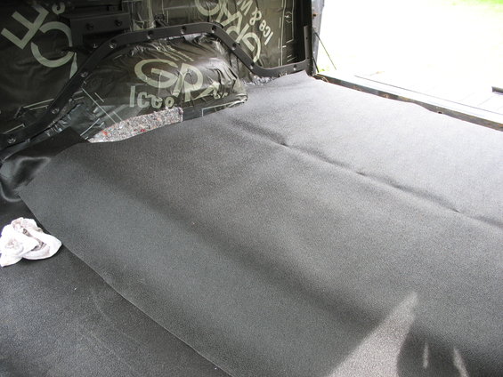 Interior of vehicle with sound dampening and new carpet installed