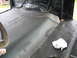 1978 Ford Bronco - The interior floor of a vehicle shows new carpeting and sound deadening material being installed.