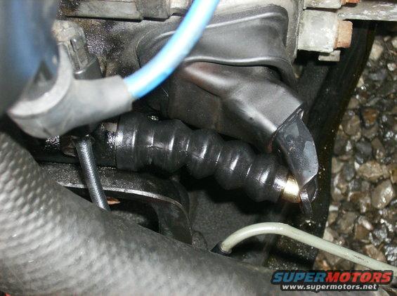Clutch slave cylinder boot and linkage