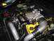 2003 Mercury Marauder - Close-up view of a modified engine bay a prominent supercharger and yellow painted valve covers.
