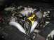 2003 Mercury Marauder - Engine bay with a turbocharger and custom modifications. The yellow valve covers are prominent.