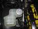 2003 Mercury Marauder - Close-up of a coolant reservoir and supercharger cap in an engine bay.