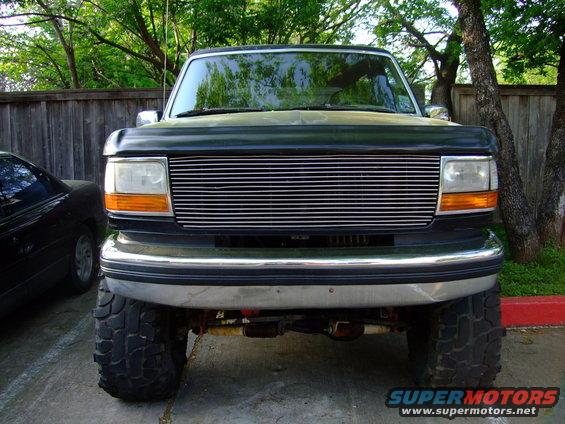Black 1992 Ford Bronco front view with chrome grille and lifted suspension