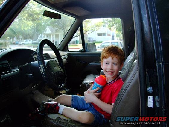 Interior of 1992 Ford Bronco with boy in passenger seat