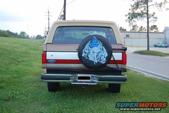 1989 Ford Bronco rear view with wolf and flag spare tire cover