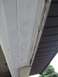 1996 Ford Bronco - Detail of house soffit and fascia, showing texture marks on the white soffit.