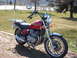 1982 Yamaha Maxim - A red 1982 Yamaha Maxim motorcycle is parked outdoors on a sunny day.