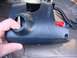 1996 Ford Bronco - Close-up of a black plastic steering column shroud, likely removed for repair or modification.