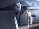 1996 Ford Bronco - Ignition cylinder with keys and a screwdriver inserted nearby.