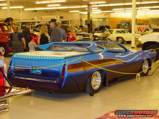 dsc00954.jpg It goes topless and looks good with owner built tal lights and tail gate!