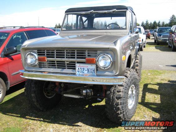 Gray 1970s Ford Bronco front view with large tires and Washington license plate