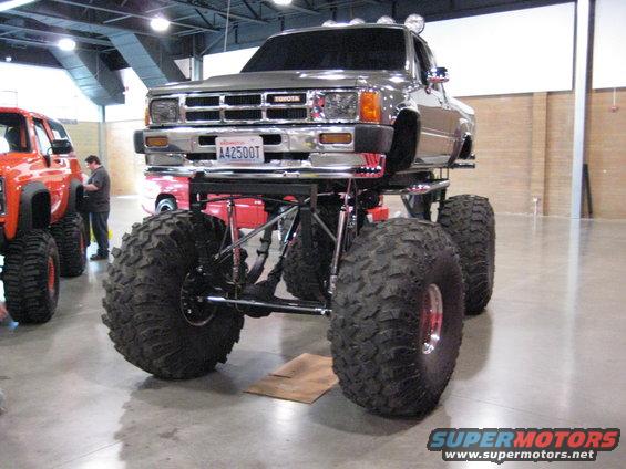 Monster truck with Toyota badge and large tires, front view