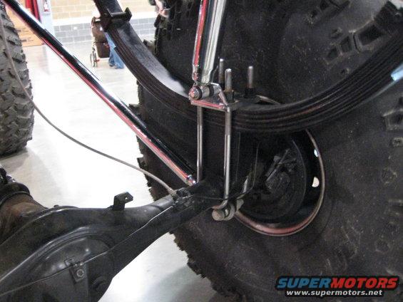 Rear suspension leaf springs and differential with Supermotors.net logo