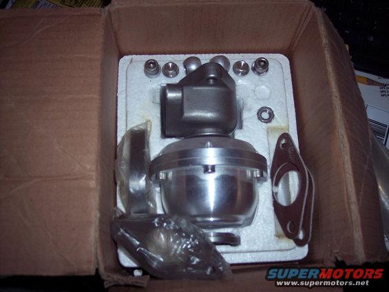 Blow-off valve with gasket and bolts in a cardboard box
