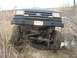 1990 Ford Bronco - Front view of a 1990 Ford Bronco navigating a muddy off-road path.