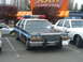 1987 Ford Crown Victoria LTD - A 1987 Ford Crown Victoria LTD police car is parked in a lot next to another police vehicle.