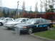 1987 Ford Crown Victoria LTD - Two police vehicles are parked side-by-side, one marked 'Town Marshal' and the other with a 'POLICE' shield.