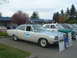 1987 Ford Crown Victoria LTD - A vintage police car, likely from the early 1970s, is displayed with informational boards at an outdoor event.