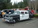 1987 Ford Crown Victoria LTD - A 1956 police car replica is displayed next to a fire truck.