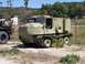 1990 Ford Bronco - This tracked vehicle, marked with the number 621, is parked next to another military vehicle.