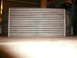 1996 Ford Probe - An intercooler part is shown in a garage setting.