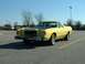 1978 Ford Ranchero - This 1978 Ford Ranchero pickup truck features a yellow body with a contrasting black hood and a custom license plate.