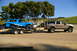 1986 Ford Bronco - Blue 1986 Ford Bronco being towed by a Ford Excursion on a sunny day.
