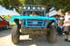 1986 Ford Bronco - This modified 1986 Ford Bronco features a prominent roll cage and a roof-mounted light bar, ready for off-road adventures.