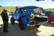 1986 Ford Bronco - This modified Bronco features a custom roll cage and external spare tire, suggesting off-road use.