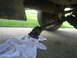 1994 Ford Bronco - The driveshaft has been disconnected from the vehicle and is resting on a white towel.