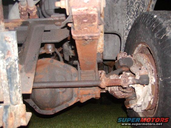 Rusty Dana 60 differential and leaf spring assembly on a vehicle