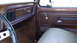 1979 Ford F-350 - The interior of a 1979 Ford F-350 Supercab features woodgrain trim and a "Ranger XLT" badge.
