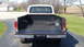 1979 Ford F-350 - Rear view of a 1979 Ford F-350 pickup truck, displaying its tailgate and empty bed.