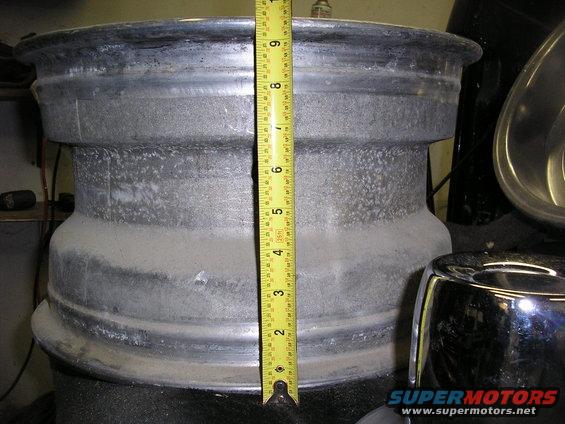 Wheel rim with tape measure showing 9 inches