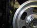 1987 Ford Bronco - Detail shot of a vehicle's wheel and inner fender area.