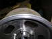 1987 Ford Bronco - Close-up view of an aluminum wheel, showing the lug nut pattern and rim detail.