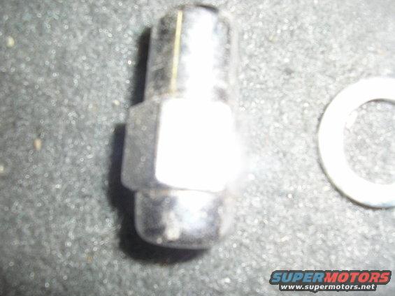 Lug nut and washer on textured surface