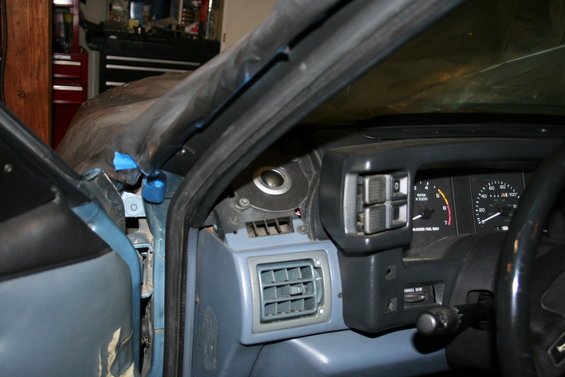 1990 Ford Mustang interior with dashboard and gauges visible