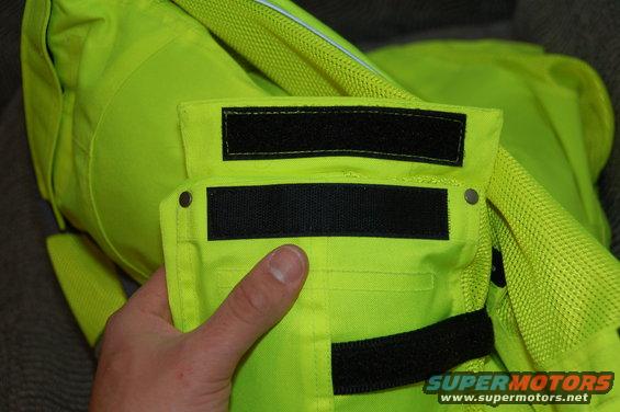 Neon yellow motorcycle jacket with black velcro closures and a pocket