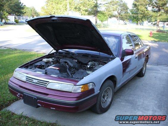 1993 Ford Crown Victoria 3q-front view, hood open, maroon and grey body