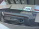 1996 Ford Bronco - A car door panel, possibly for a sedan, is shown inside its shipping box.
