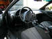 1993 Ford Probe - The interior of a 1993 Ford Probe is visible, including the dashboard, steering wheel, and seats.