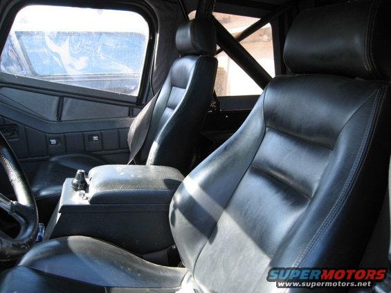 Black leather bucket seats and center console in a vehicle interior