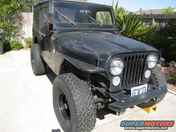 Black Jeep CJ7 front 3/4 view with California license plate 'RAJA JEP'