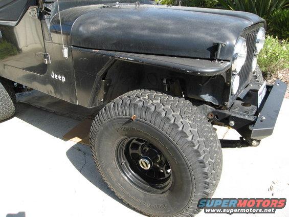 Black Jeep CJ with aftermarket bumper and off-road tires