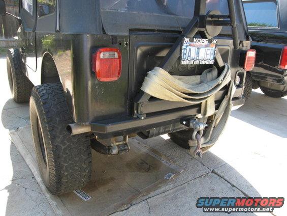 Black Jeep CJ7 rear bumper with spare tire mount and strap