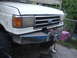 1989 Ford Bronco - Front view of a Ford F-Series truck, showing the grille and a custom winch bumper.
